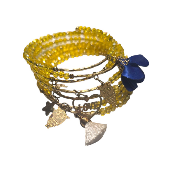 Rubylishious
Handmade yellow glass bead memory wire bracelet
With gold, white - Picture 2 of 2